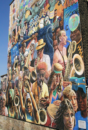 Hackney Peace Carnival mural on Dalston Lane, seen from the top deck of a passing bus