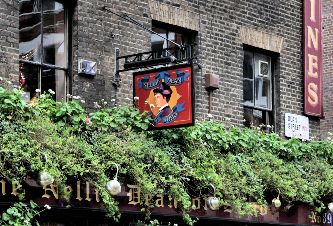 Upper floor and pub sign of the Nellie Dean of Soho